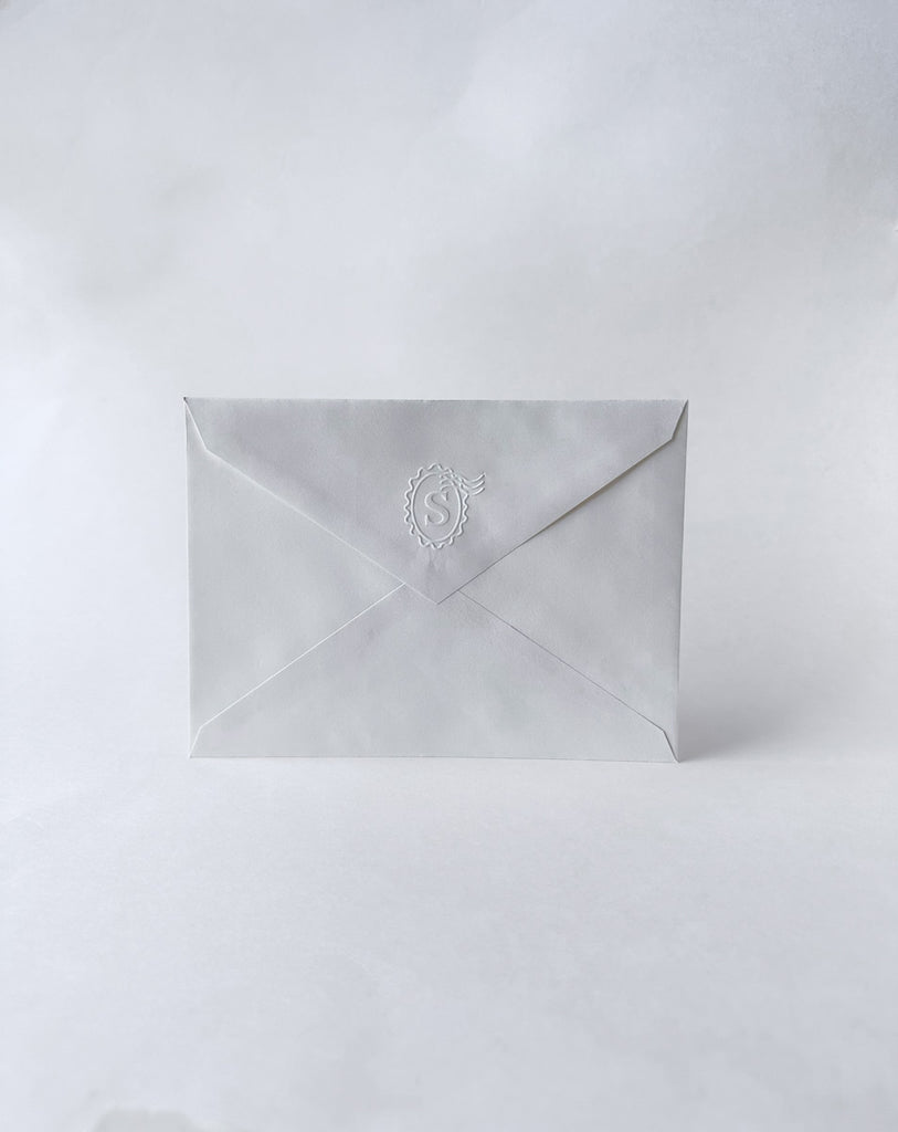 Scratch-off notecard envelope with embossed logo