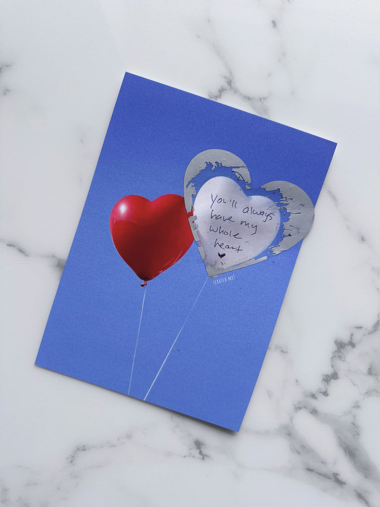 Sky balloons scratch-off card with message inside